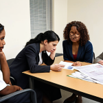 **

A diverse group of people receiving assistance at a victim support center. Focus on the emotions of relief and hope. Show a lawyer providing advice, a psychologist offering comfort, and financial aid workers assisting with paperwork. The scene should convey accessibility and a sense of being supported by the state and community.

**